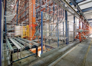 The installation of stacker cranes is an example of industrial process automation in logistics The installation of stacker cranes is an example of industrial process automation in logistics